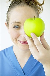 Nurse holding an apple